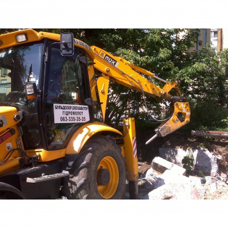 Ломка здания гидромолотом CAT H65